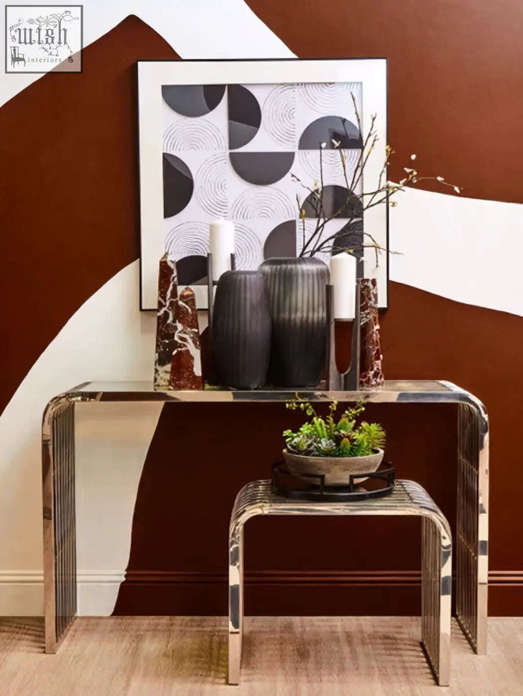 The dante small washed grey finish candle holder displayed on a sleek mirrored console table with chrome legs