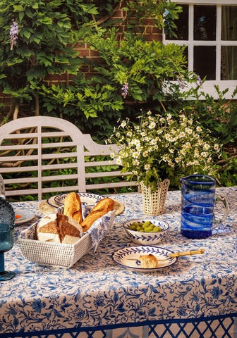 Blue and white patterned tablecloth with floral design perfect for adding charm to your dining or outdoor table setup