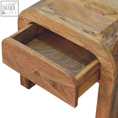 Curved darcy bedside table in solid mango wood with natural grain and brass knob single drawer bedside table