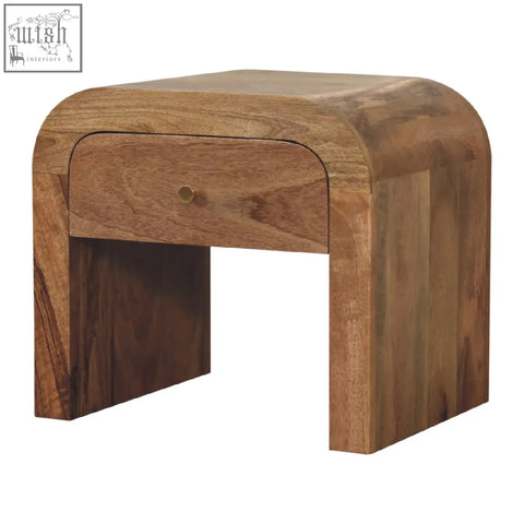 Curved darcy bedside table in solid mango wood with a single drawer and brass knob for stylish storage