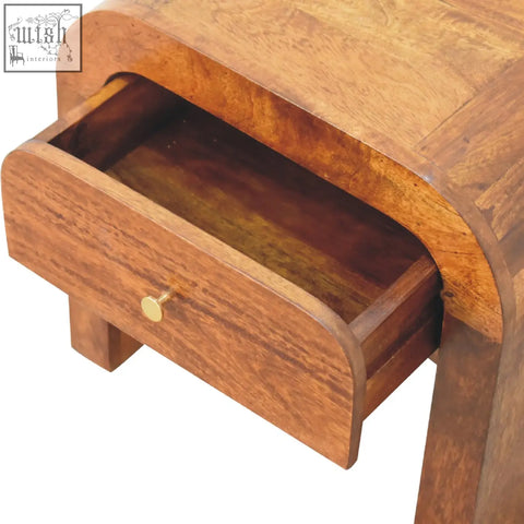 Curved wooden darcy chestnut bedside table with warm brown finish and single drawer with brass knob