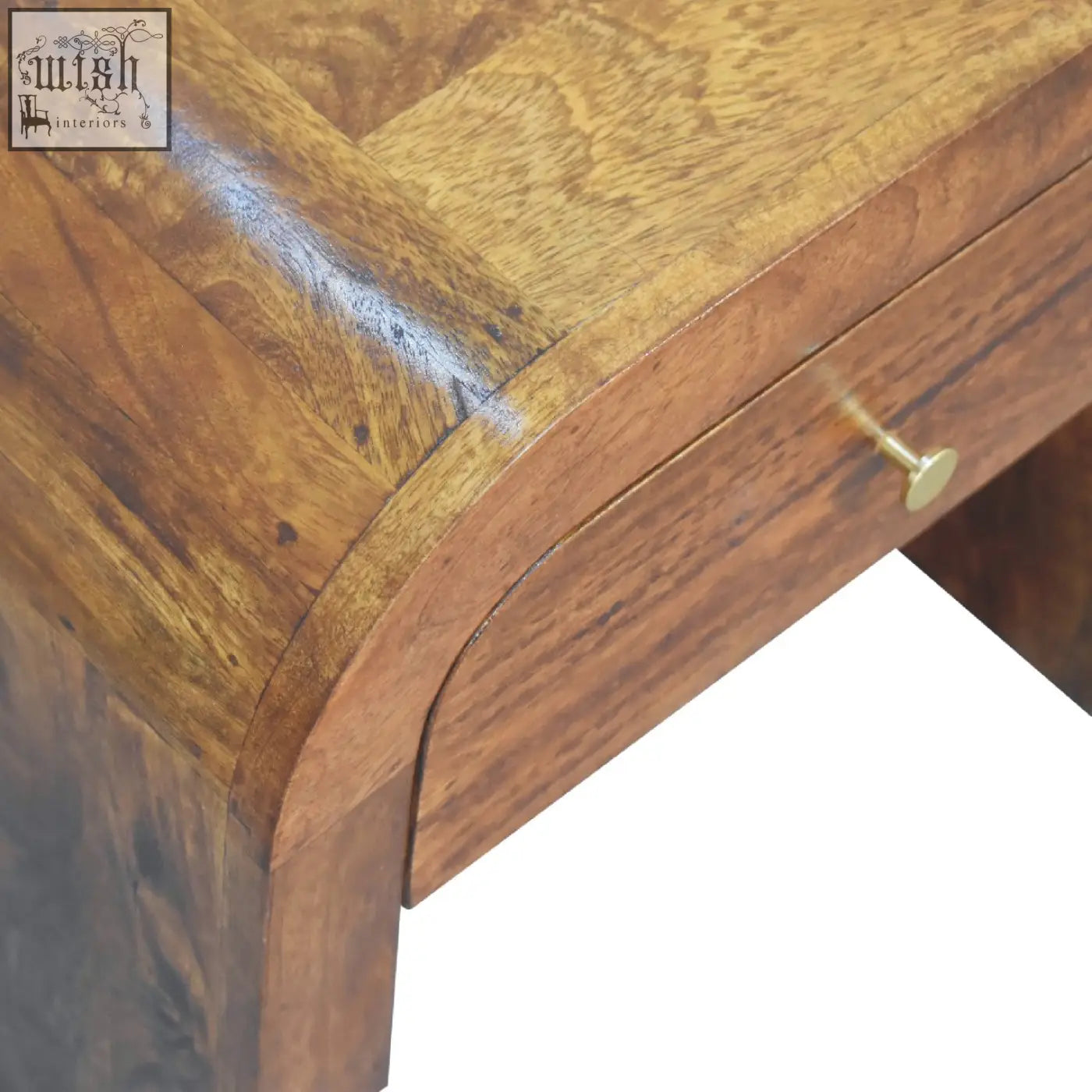Rich warm-toned wooden darcy chestnut bedside table with curved edge and brass drawer pull in chestnut bedside style