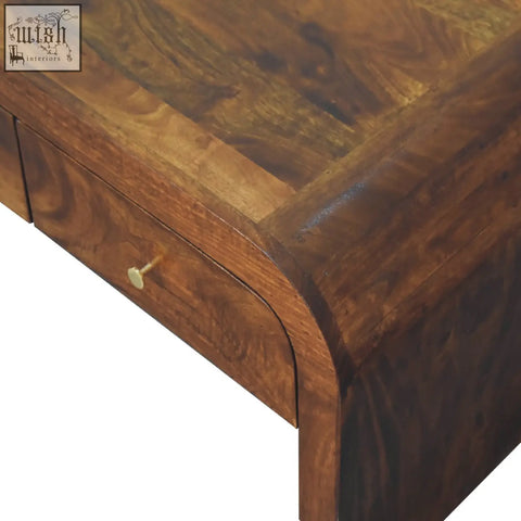 Rich dark brown wooden darcy chestnut coffee table with curved front and single drawer with brass knob