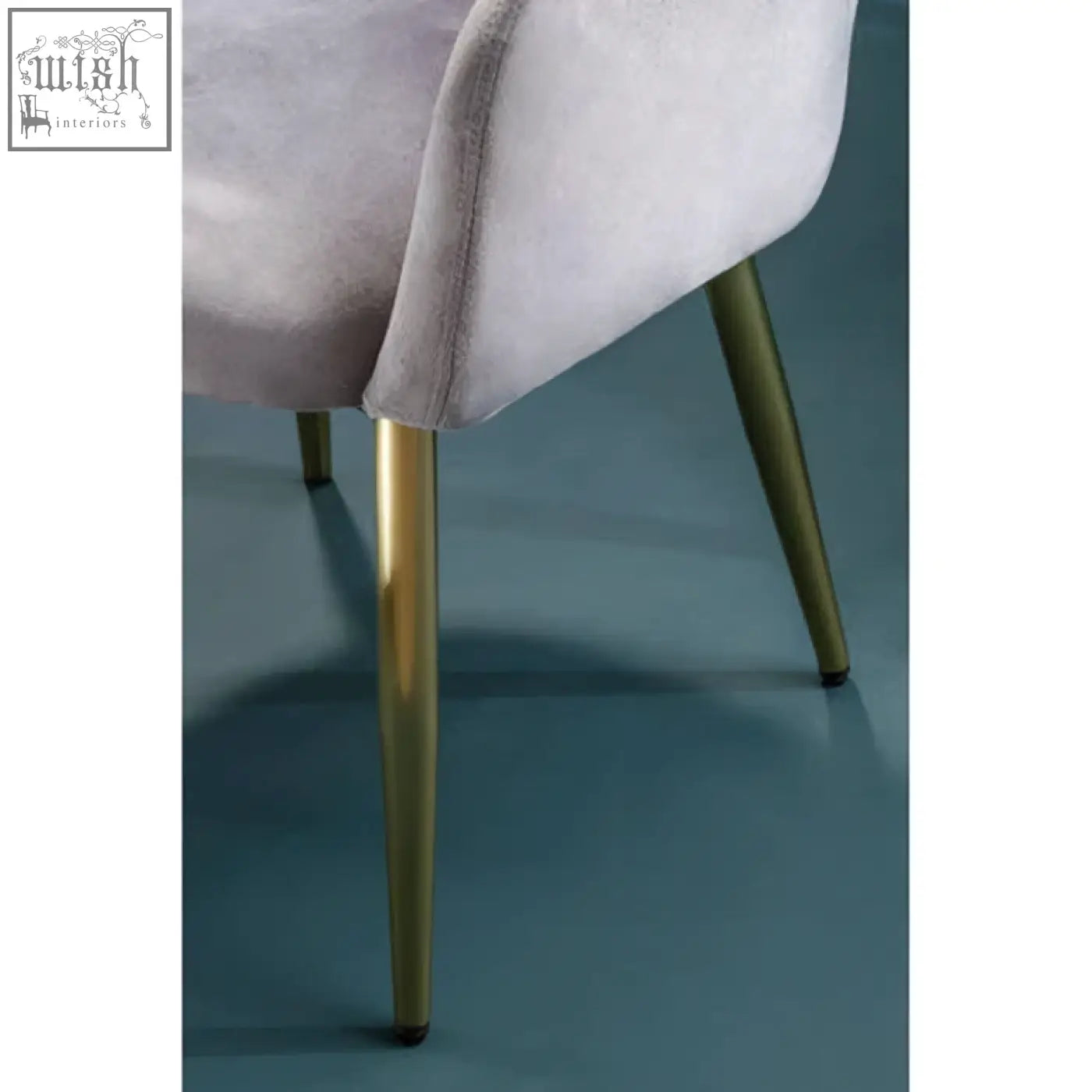 A plush lavender velvet dining chair with slender gold-tone metal legs perfect for stylish grey velvet dining spaces