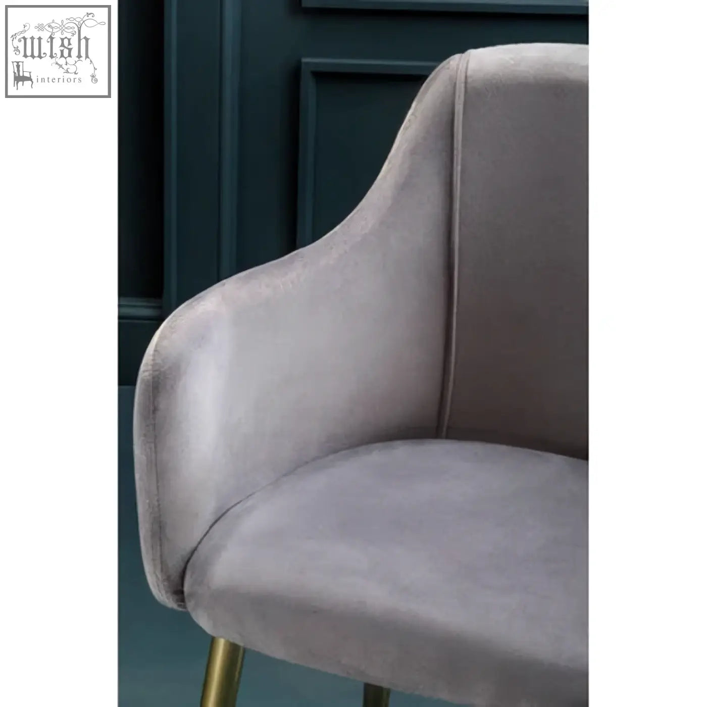 A sleek grey velvet dining chair with elegant gold-tone legs perfect for stylish dining rooms
