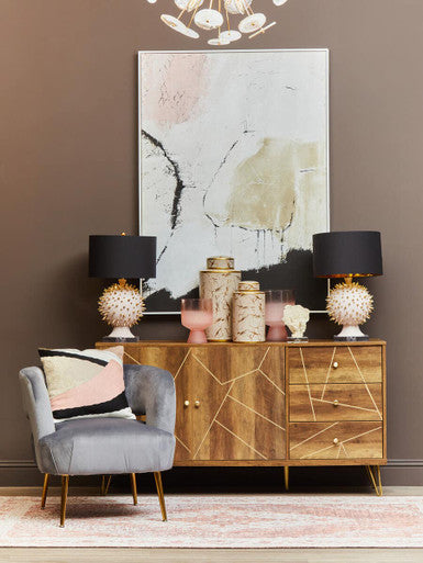 The daria large ceramic jar sits on a wooden console table with geometric inlay and gold-toned hardware