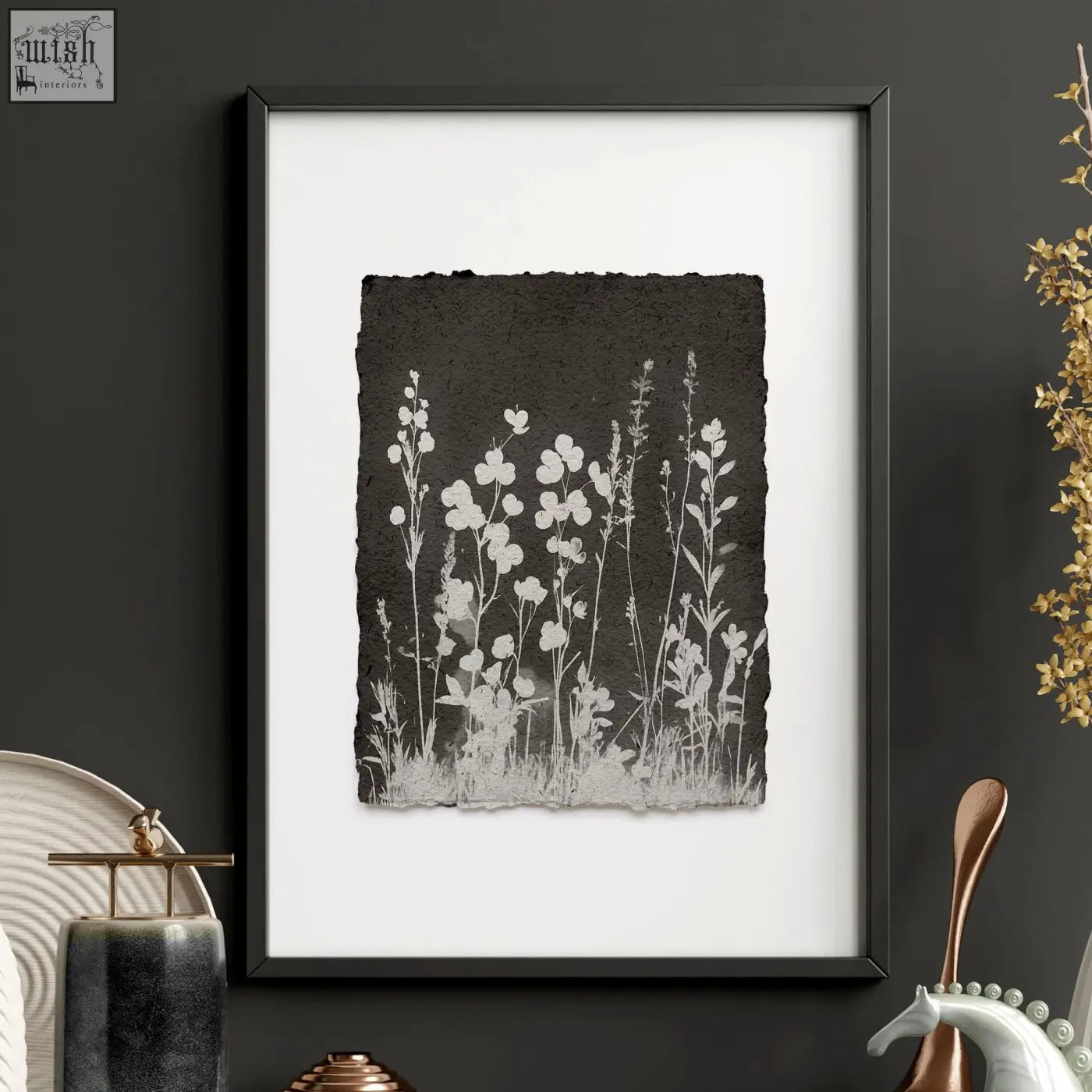 Black-framed wall art with delicate white wildflower silhouettes on dark gray background perfect for brown wall art