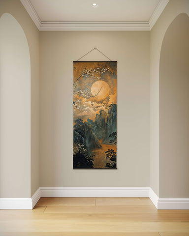 A dark chinoiserie tapestry featuring a vertical scroll painting of mountains blossoming trees and a full moon