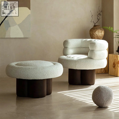 Cream-colored darlene armchair with plush boucle texture stacked cushions and dark brown cylindrical legs