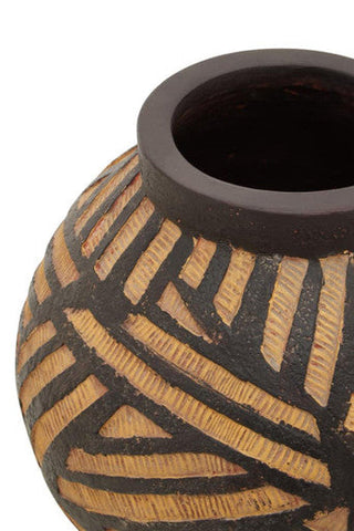 A darnell round natural ceramic vase with a dark brown rim and black tan geometric patterns
