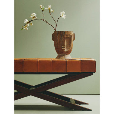 A darnell small natural wooden face planter with carved features and a warm brown finish for small natural face decor