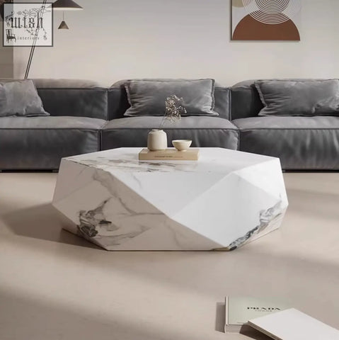 Geometric white marble darwin coffee table with gray veining and faceted edges made of sintered stone