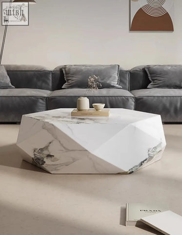 Geometric white marble darwin coffee table with gray veining and faceted edges in durable sintered stone