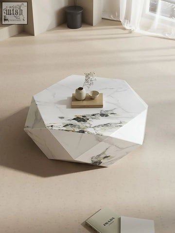 Geometric white marble darwin coffee table with faceted design and subtle gray veining in sintered stone