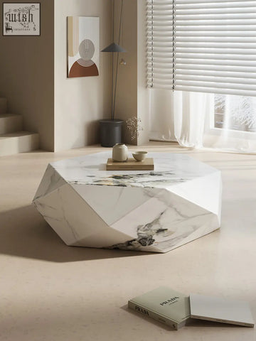 Geometric white marble darwin coffee table with faceted design and subtle gray veining in sintered stone