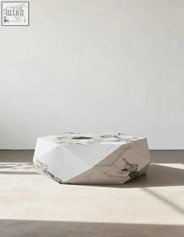 A sleek darwin coffee table with white marble top and gray veining made from durable sintered stone