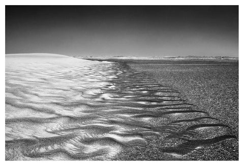 Black and white fine art photo of a sand dune with intricate wind patterns by david ballam nam09
