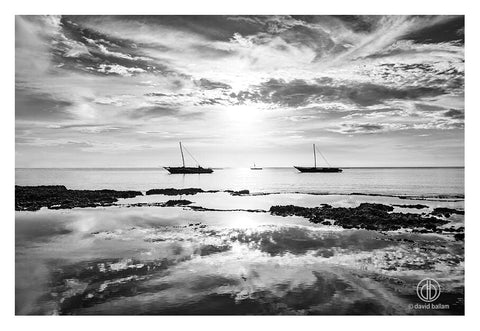 Two traditional wooden sailboats glide on calm waters under a dramatic sky fine art by david ballam zan 62