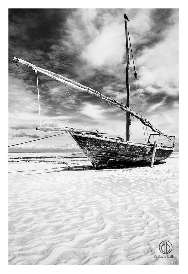Weathered wooden fishing boat with tall mast on sand under overcast sky fine art by david ballam zan 63