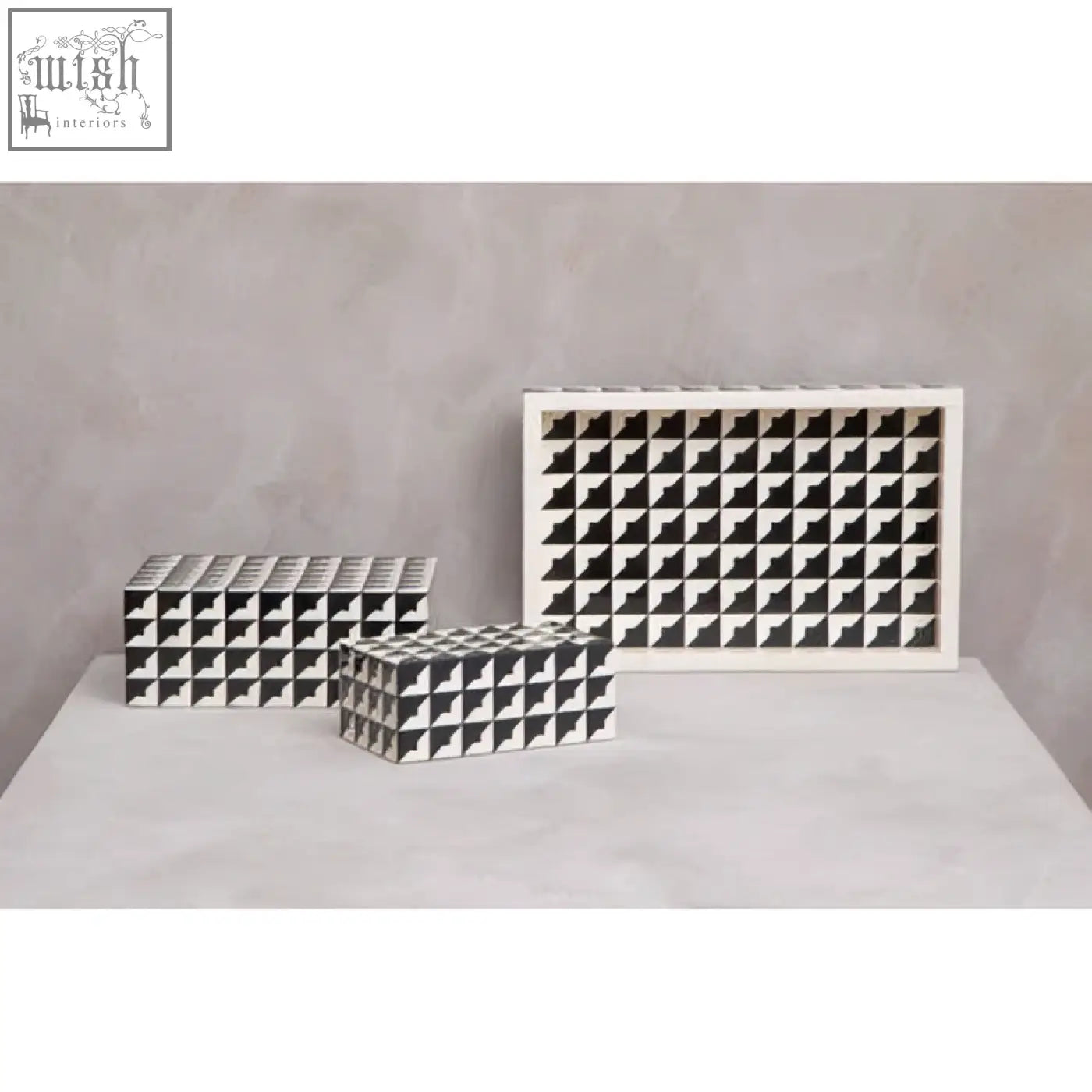 White ceramic grid storage boxes with black geometric patterns on davino black and white tray with raised edges