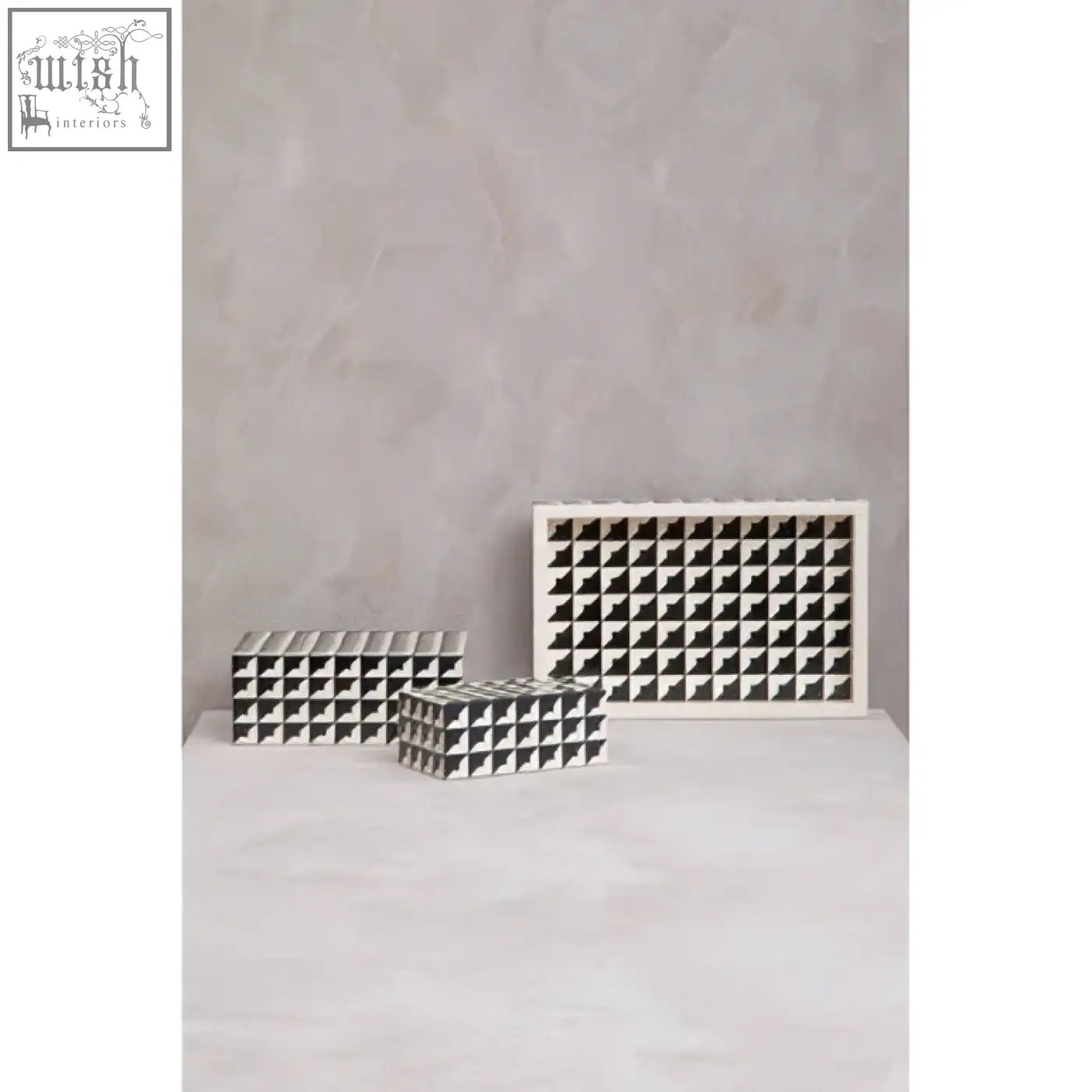 White ceramic wine rack with square compartments featured on davino black and white tray with raised edges