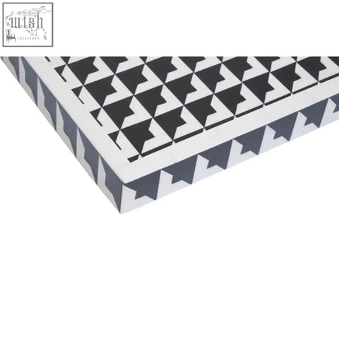 Davino black and white tray with raised edges featuring a modern black and white geometric pattern and angular design