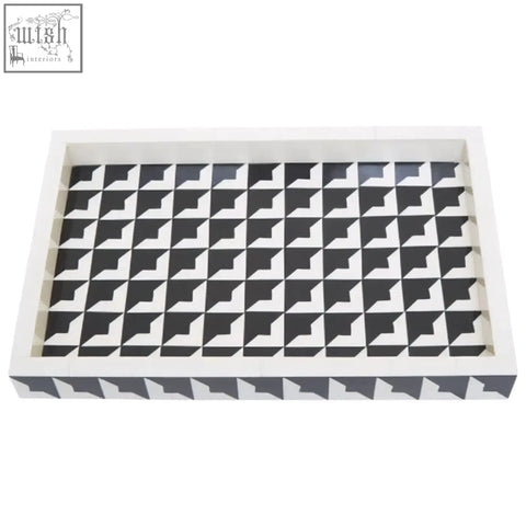 White rectangular davino black and white tray with raised edges and geometric interlocking triangle pattern