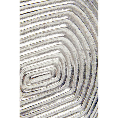 Silver small vase with a metallic textured circular patterned rug base perfect for modern decor accents