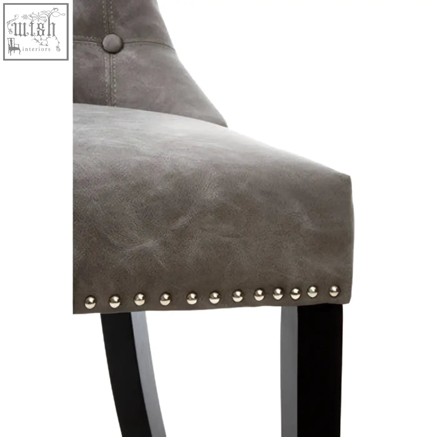 Daxton grey leather dining chair with gray faux leather, silver nailhead trim, and black rubberwood legs