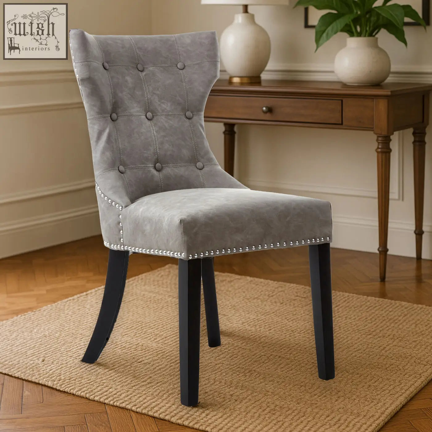 Daxton grey leather dining chair with gray tufted velvet upholstery and black rubberwood legs with silver nailhead trim