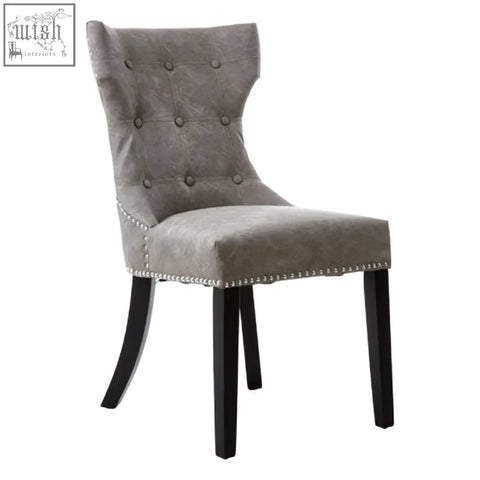 Daxton grey leather dining chair with gray tufted velvet seat and black rubberwood legs with nailhead trim