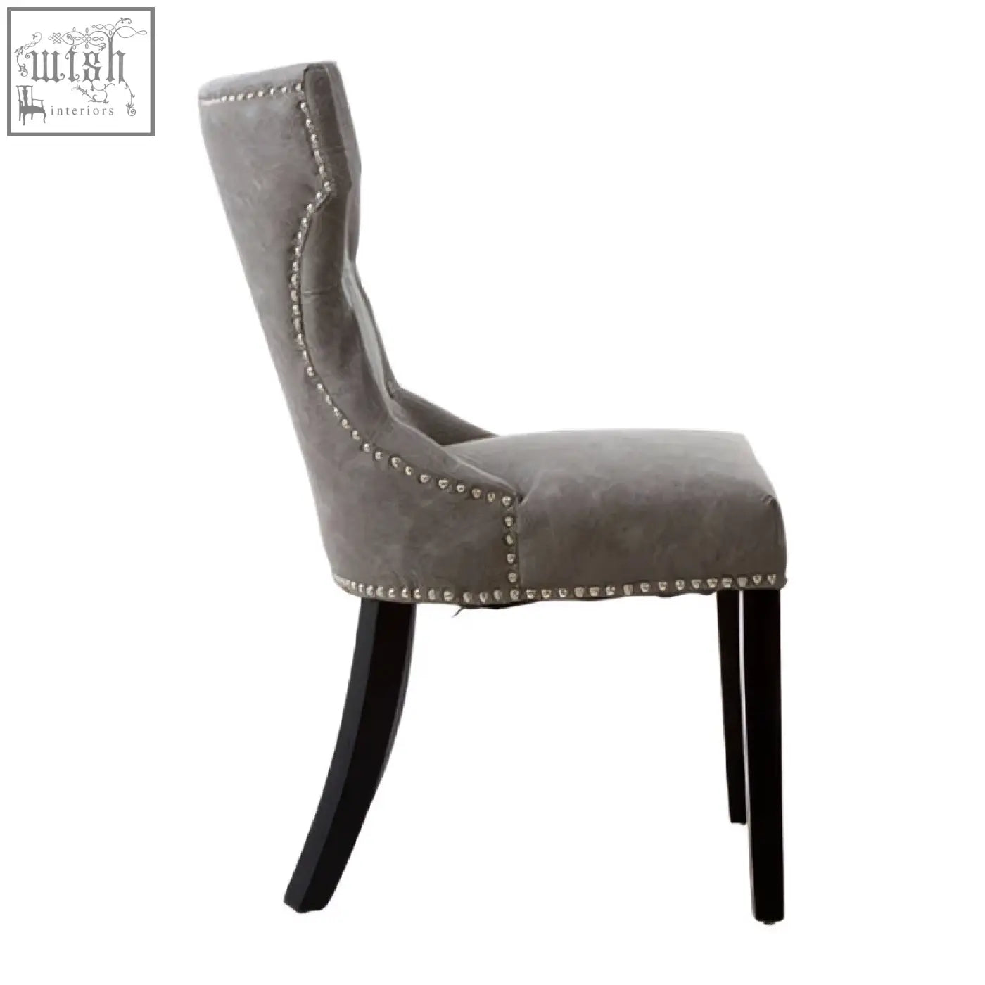 Daxton grey leather dining chair with gray upholstery, black rubberwood legs, and decorative nailhead trim