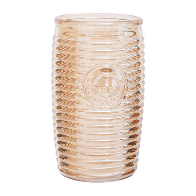 A translucent peach-colored glass vase with vertical ridges in the style of four gold ribbed glass tumblers