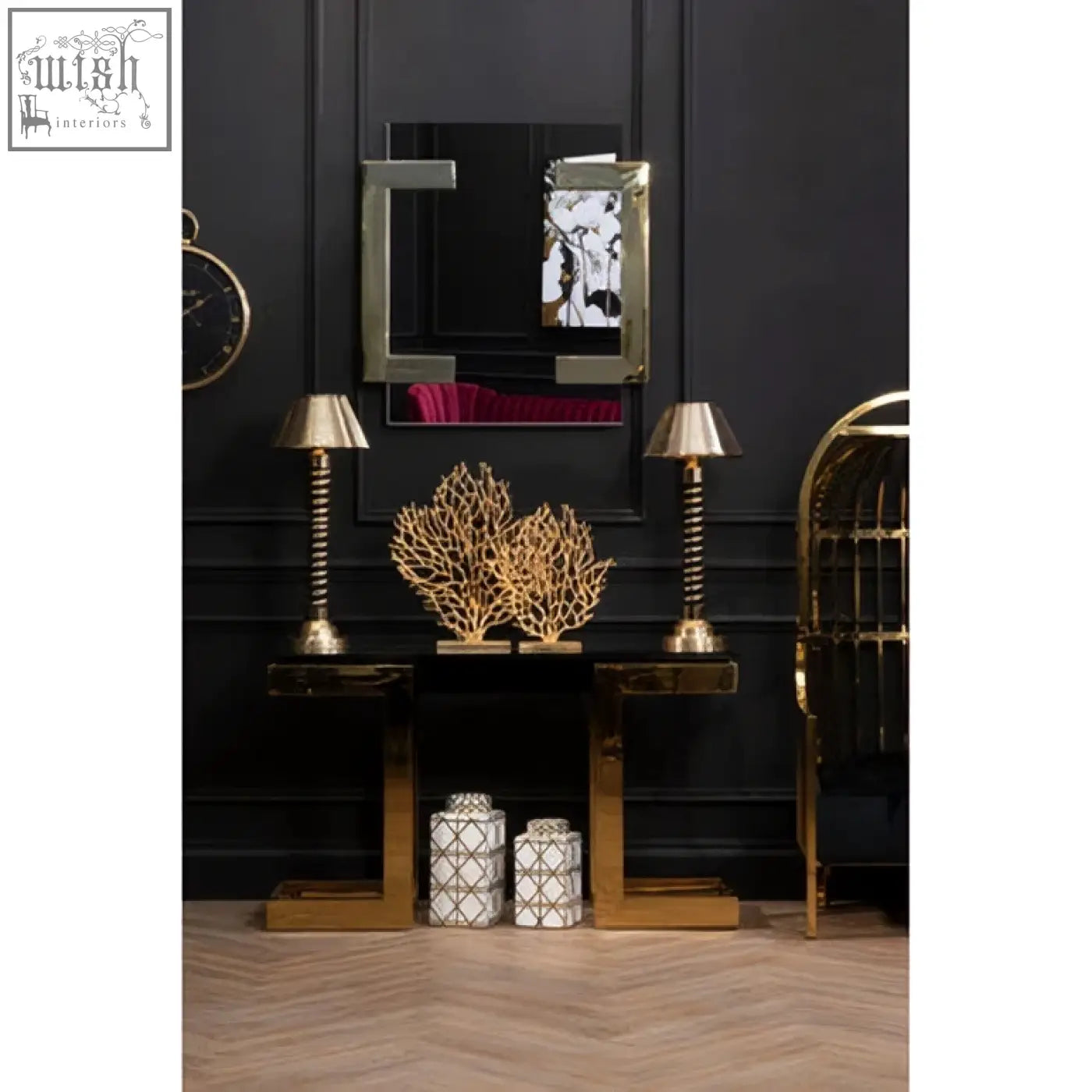 Gold-framed mirror with black reflective surface and silver border on deana gold and black console table