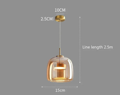 Decao light pendant lights with a warm amber glass dome and brass finished metal for modern interiors
