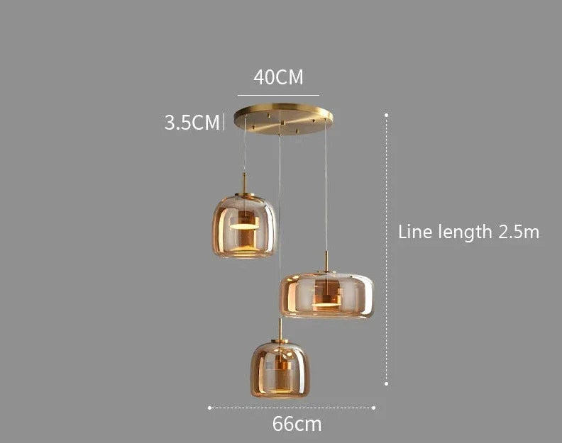 Modern gold-toned glass pendant lights with three tiered rounded shades suspended by thin cords from decao light