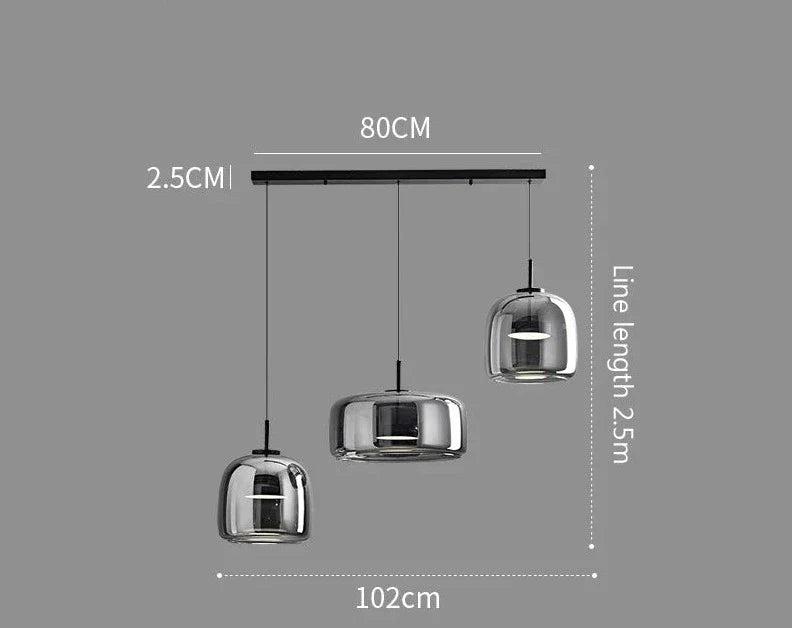 Modern chrome-finished pendant lights with three bell-shaped glass shades on a sleek black bar by Decao Light