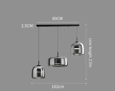Modern chrome-finished pendant lights with three bell-shaped glass shades on a sleek black bar by Decao Light