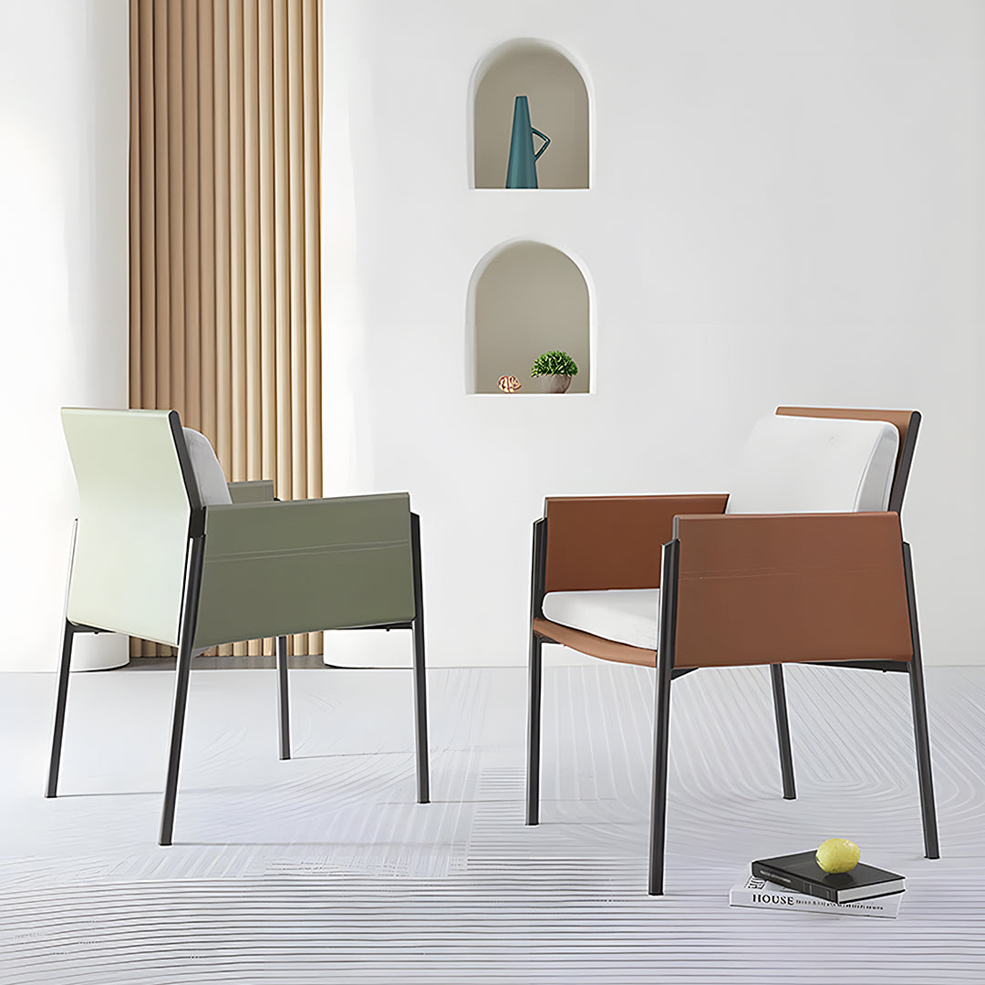 Modern decker dining chair with armrests in olive green and brown leather with white cushions and sleek black metal frame