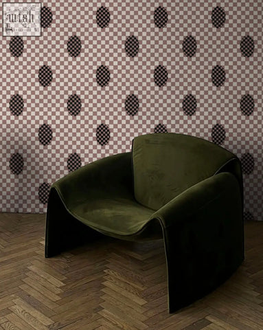 A plush olive green velvet armchair with sleek modern design featuring micaela sharp deco checkers digital printing wallpaper