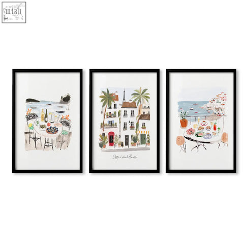 Set of three black-framed sotto il sole watercolor art prints featuring coastal and parisian wall art for bathroom decor