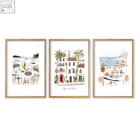 Three framed sott o il sole coastal and parisian art prints with white matting and light wood frames for wall art decor