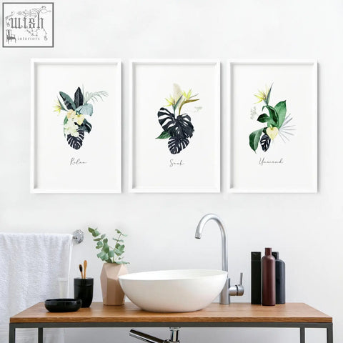 Set of 3 tropical wall art with minimalist white frames featuring green and cream botanical prints for bathroom walls