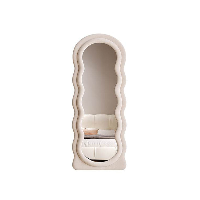 Cream-colored plush velvet framed deenz modern full length mirror with wavy sculpted border