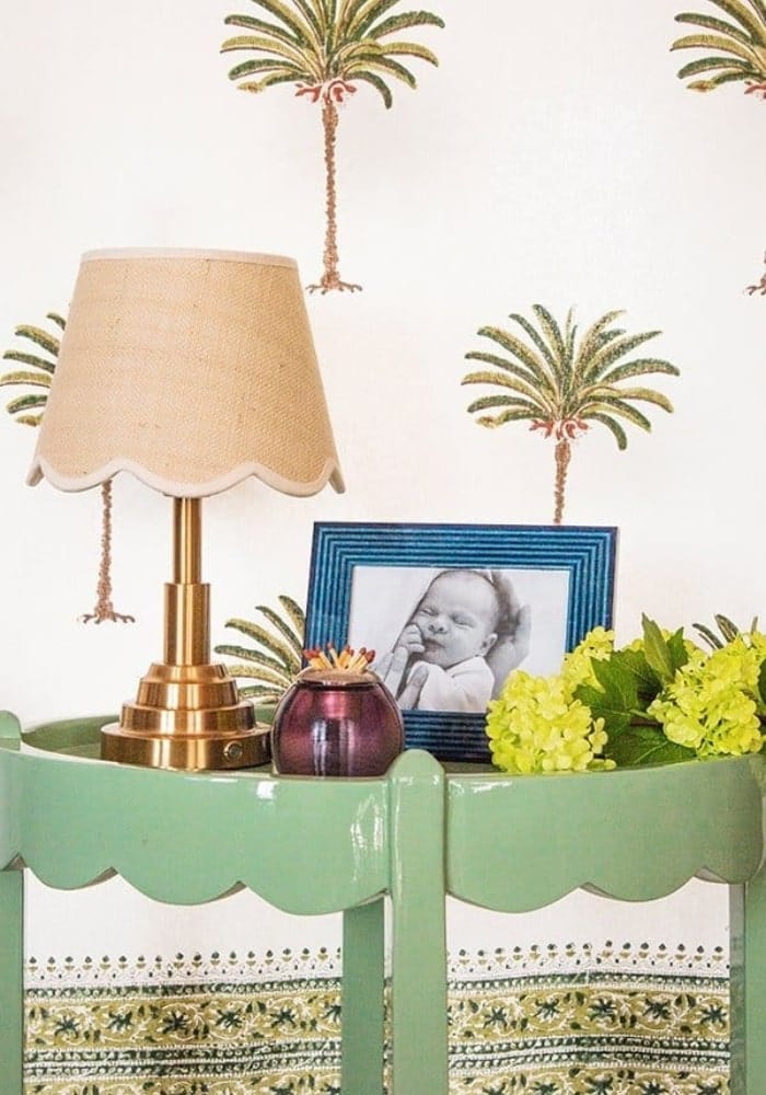Deep blue marquetry photo frame 6x4 with a brass table lamp featuring a beige scalloped fabric shade