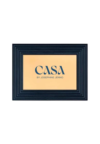 A sleek black-framed deep blue marquetry photo frame 6x4 with a beige interior and casa by josephine jenno logo