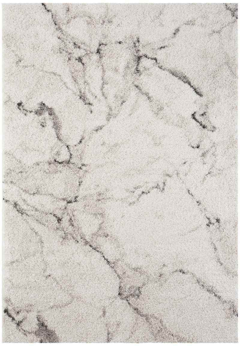 A plush deep-pile velour rug cream colour with a subtle gray marble pattern perfect for cozy spaces
