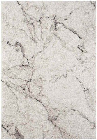A plush deep-pile velour rug cream colour with a subtle gray marble pattern perfect for cozy spaces