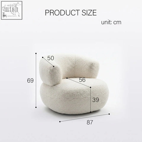 Cream-colored plush deirdre armchair in soft white boucle fabric with cloud-like rounded contours for cozy seating
