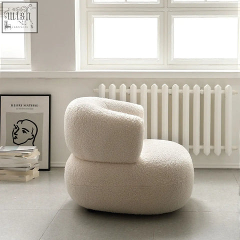 Cream-colored plush deirdre armchair in white boucle with rounded modern design perfect for cozy seating